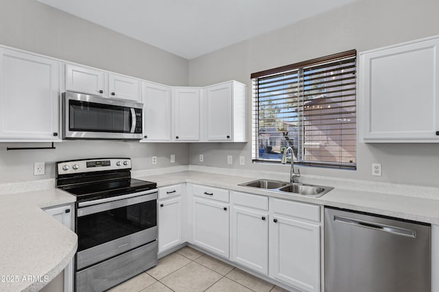 kitchen with white cabinetry, sink, and appliances with stainless steel finishes