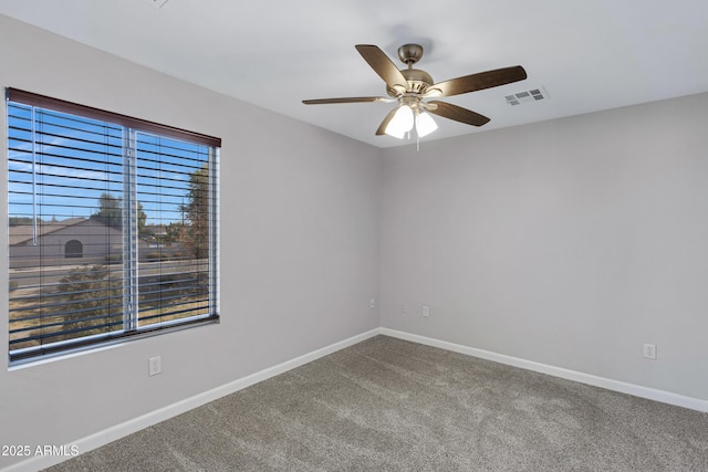 carpeted empty room with ceiling fan