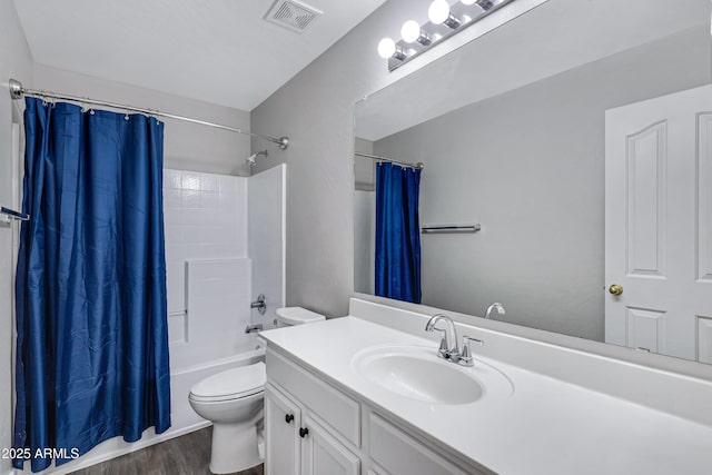 full bathroom with vanity, hardwood / wood-style floors, shower / bath combination with curtain, and toilet