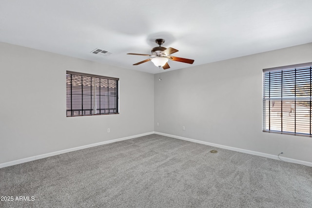 carpeted empty room with ceiling fan