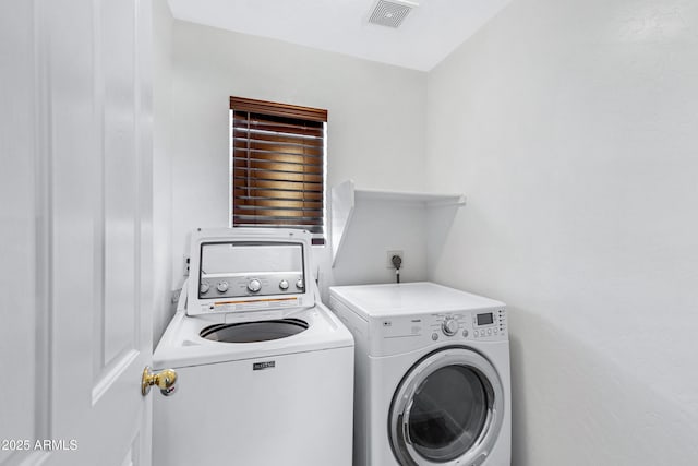 laundry room featuring separate washer and dryer