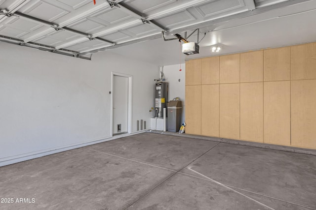 garage featuring water heater and a garage door opener