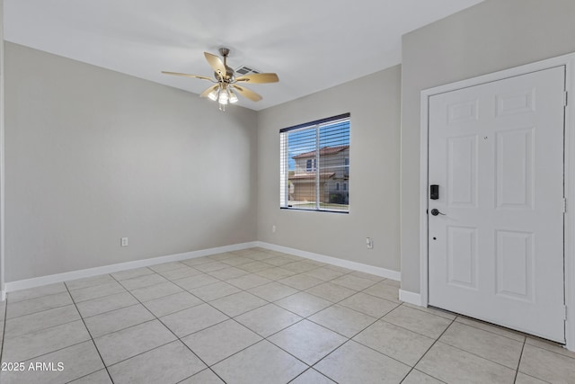 tiled foyer entrance with ceiling fan