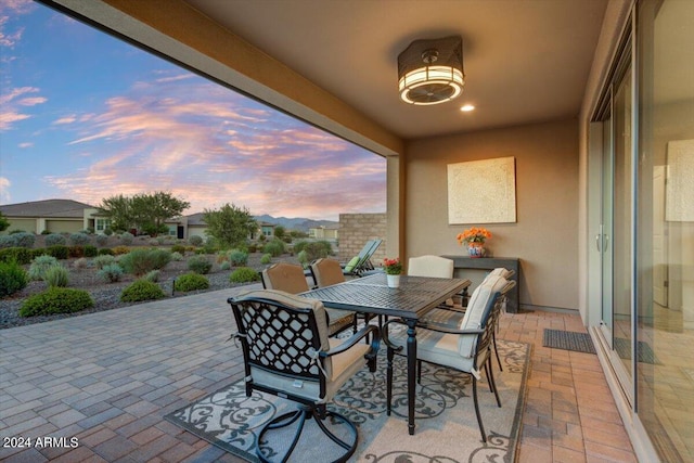 view of patio terrace at dusk