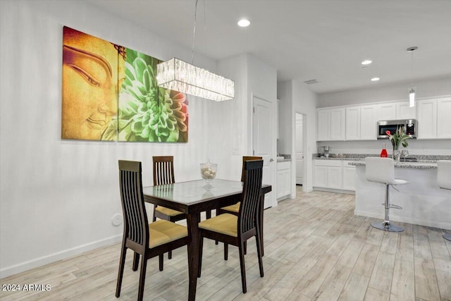 dining room with light hardwood / wood-style flooring