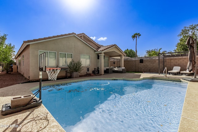 view of swimming pool featuring a patio area