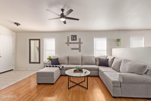 living room featuring ceiling fan, a healthy amount of sunlight, and light hardwood / wood-style floors