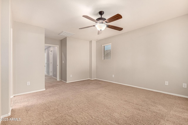 carpeted empty room with ceiling fan, baseboards, and visible vents