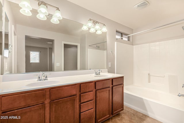 full bath with a sink, visible vents, shower / tub combination, and double vanity