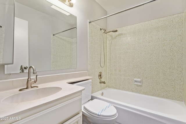 bathroom with toilet, vanity, and bathing tub / shower combination