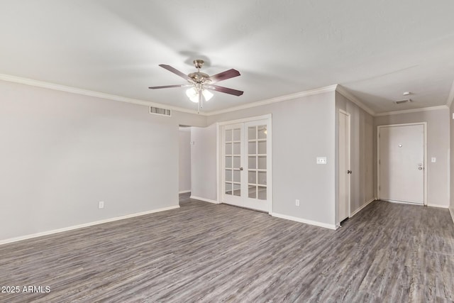 spare room with french doors, a ceiling fan, wood finished floors, and visible vents