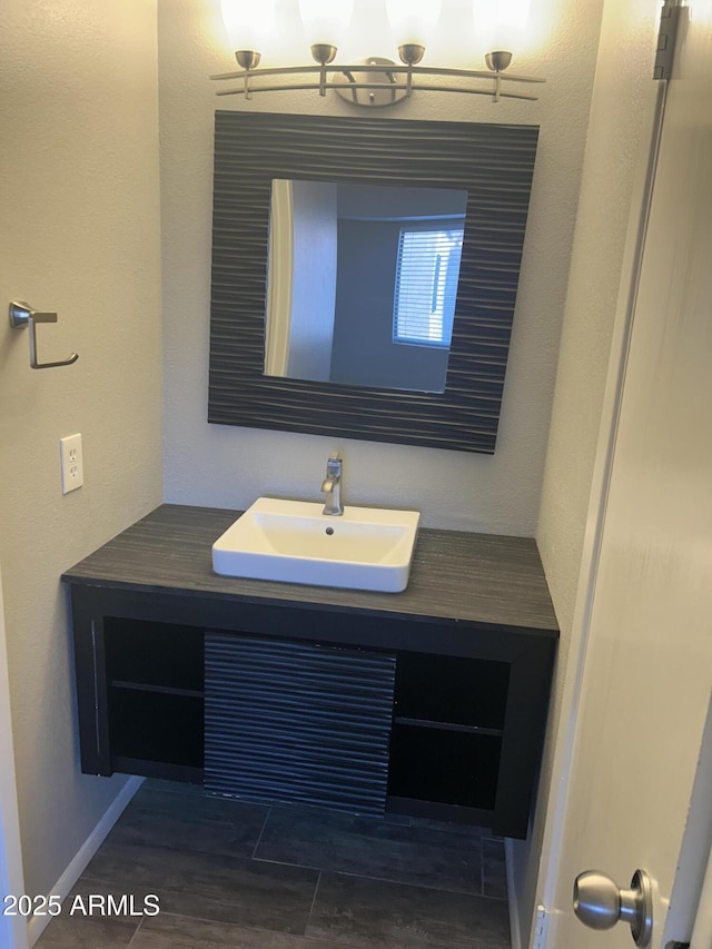 bathroom featuring vanity and wood-type flooring