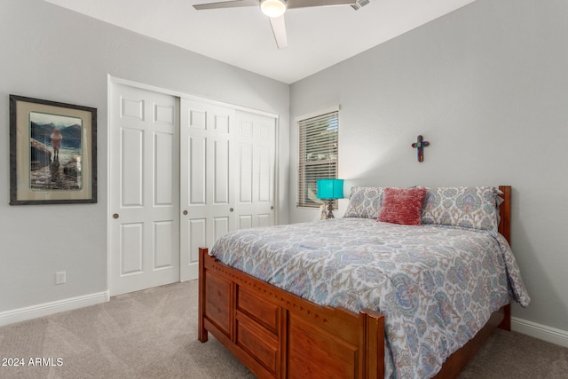 carpeted bedroom with a closet and ceiling fan