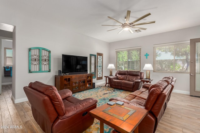 living room featuring ceiling fan and light wood-type flooring