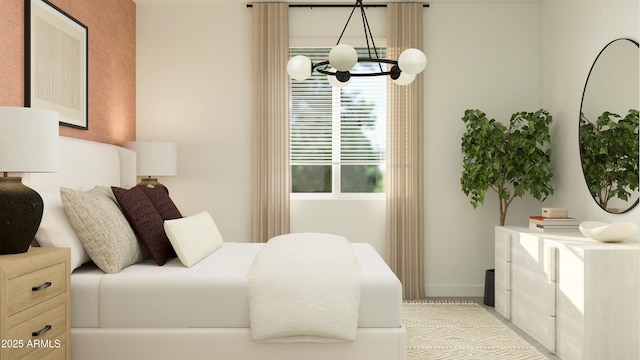bedroom featuring baseboards and an inviting chandelier