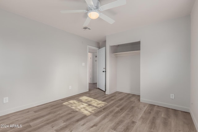 unfurnished bedroom with a closet, ceiling fan, and light hardwood / wood-style flooring