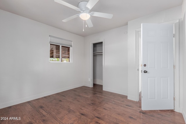 unfurnished bedroom featuring ceiling fan, a closet, and dark hardwood / wood-style floors