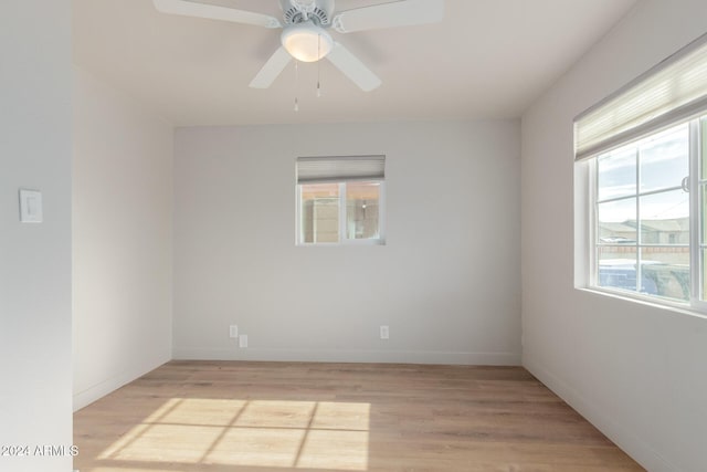 spare room featuring ceiling fan and light hardwood / wood-style floors