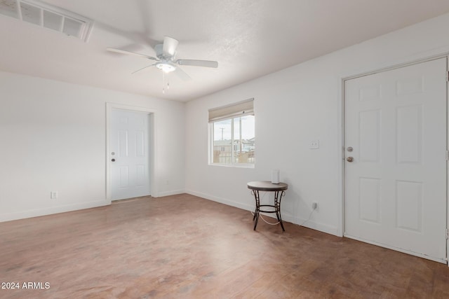 spare room with ceiling fan and hardwood / wood-style flooring