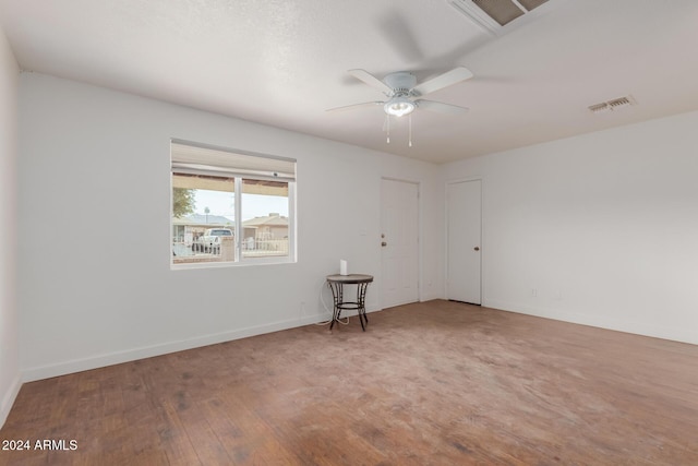 empty room with ceiling fan and hardwood / wood-style floors