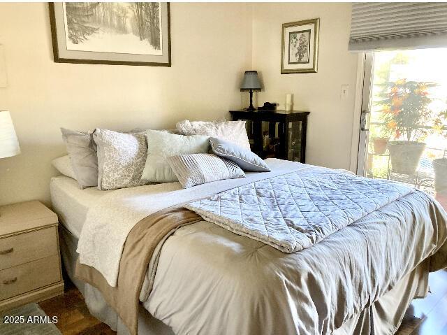 bedroom featuring wood finished floors