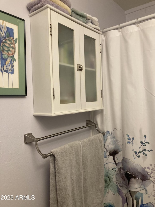 bathroom with curtained shower