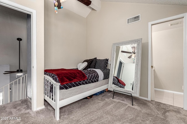 bedroom featuring visible vents, lofted ceiling with beams, and carpet