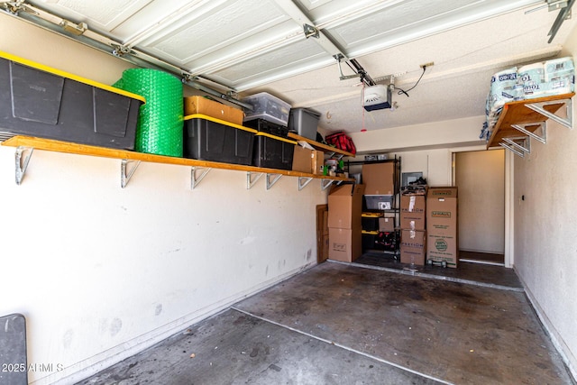 garage featuring baseboards and a garage door opener