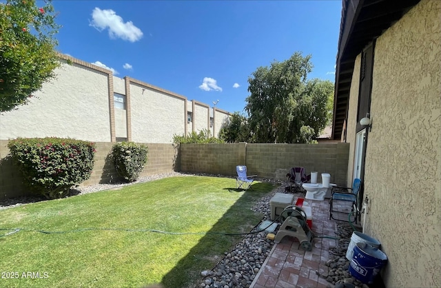 view of yard with a fenced backyard