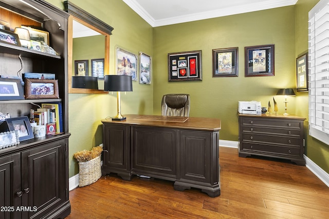 office space featuring baseboards, dark wood-type flooring, and crown molding