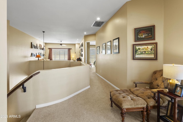 hall with recessed lighting, carpet flooring, an upstairs landing, visible vents, and baseboards