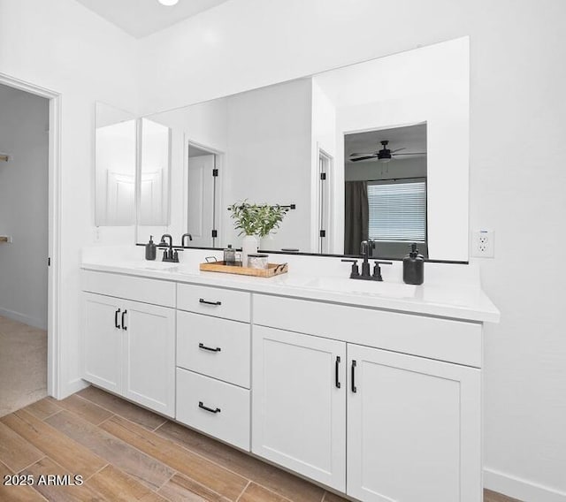 9230 E Scott Ave, Mesa, AZ 85212 - full bath featuring wood finished floors, double vanity, ceiling fan, and baseboards