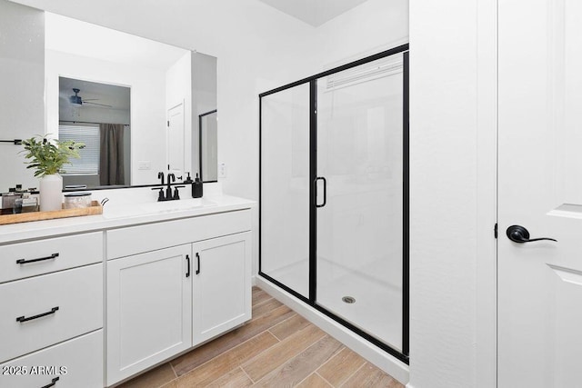 9230 E Scott Ave, Mesa, AZ 85212 - full bathroom with a shower stall, wood finished floors, vanity, and ceiling fan