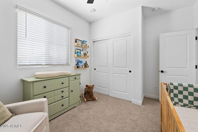 9230 E Scott Ave, Mesa, AZ 85212 - bedroom with light colored carpet, a closet, a ceiling fan, and baseboards