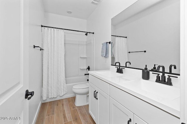 9230 E Scott Ave, Mesa, AZ 85212 - full bath featuring toilet, double vanity, shower / tub combo with curtain, and wood finished floors