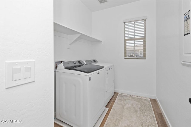 9230 E Scott Ave, Mesa, AZ 85212 - laundry room featuring independent washer and dryer, wood finished floors, and baseboards