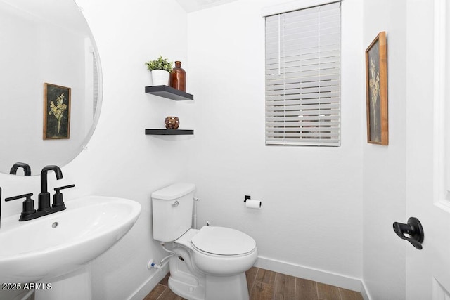 9230 E Scott Ave, Mesa, AZ 85212 - half bathroom with toilet, a sink, wood finished floors, and baseboards