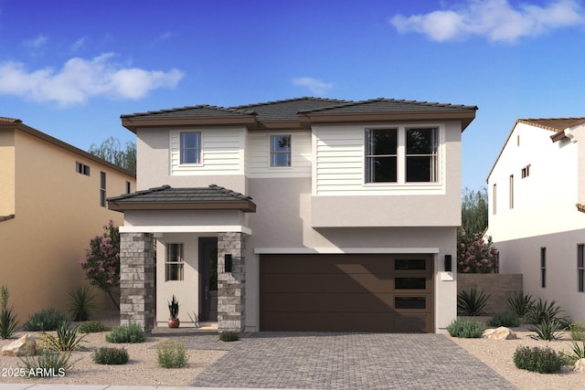 7987 W Griswold Rd, Peoria, AZ 85345 - view of front of home featuring an attached garage, a tile roof, decorative driveway, and stucco siding