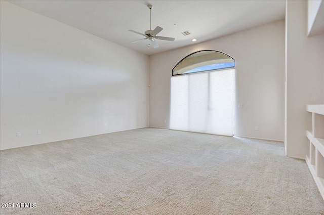 carpeted empty room with ceiling fan