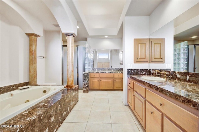 bathroom featuring decorative columns, vanity, tile patterned floors, and plus walk in shower