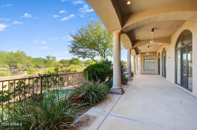 view of patio featuring ceiling fan