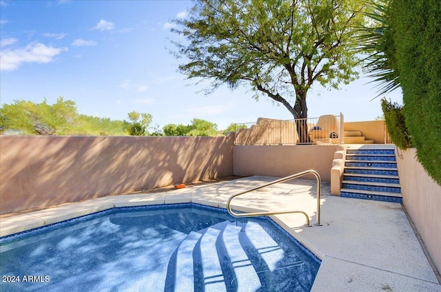 view of swimming pool featuring a patio area