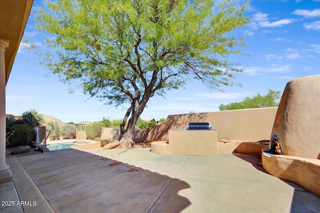 view of patio / terrace with a fenced in pool