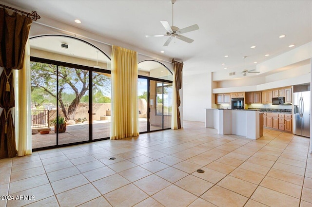 kitchen featuring light tile patterned floors, ceiling fan, and black appliances