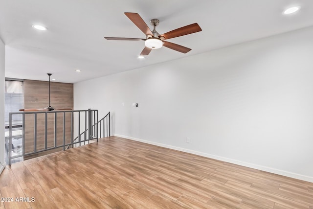 unfurnished room with light hardwood / wood-style flooring and ceiling fan