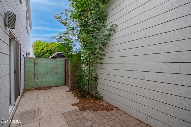 view of side of home featuring a patio