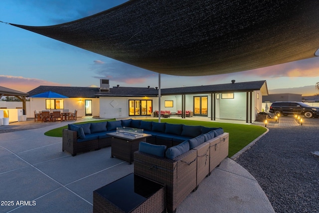 exterior space featuring outdoor dining area and an outdoor hangout area