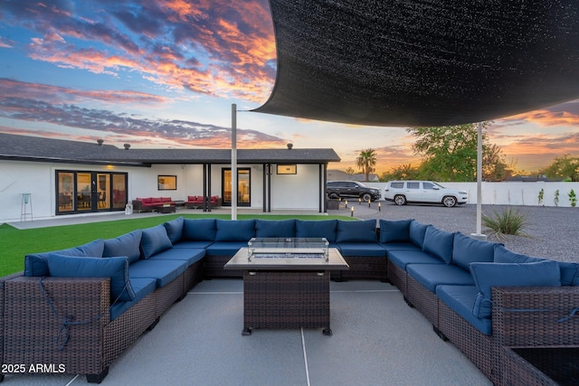 view of patio featuring an outdoor living space with a fire pit