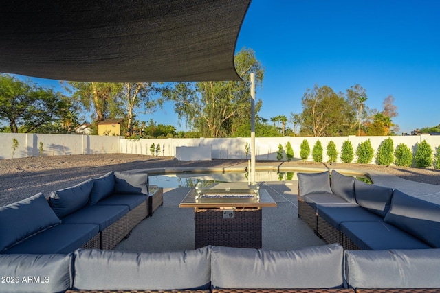 view of patio with an outdoor living space and a fenced backyard