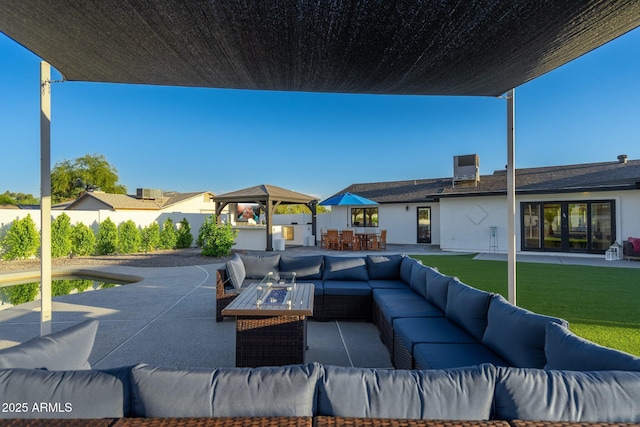 view of patio / terrace featuring fence, a gazebo, an outdoor living space, and outdoor dining area